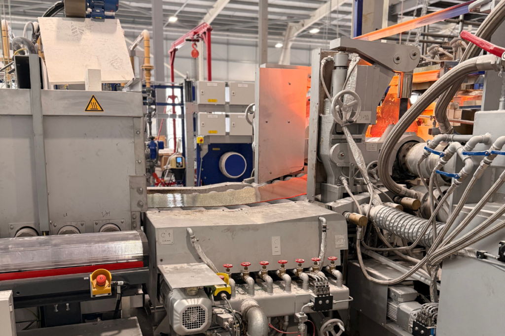 Glass Futures molten glass rolling off the line